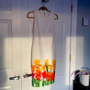 White midi dress with tulip border at hemline
